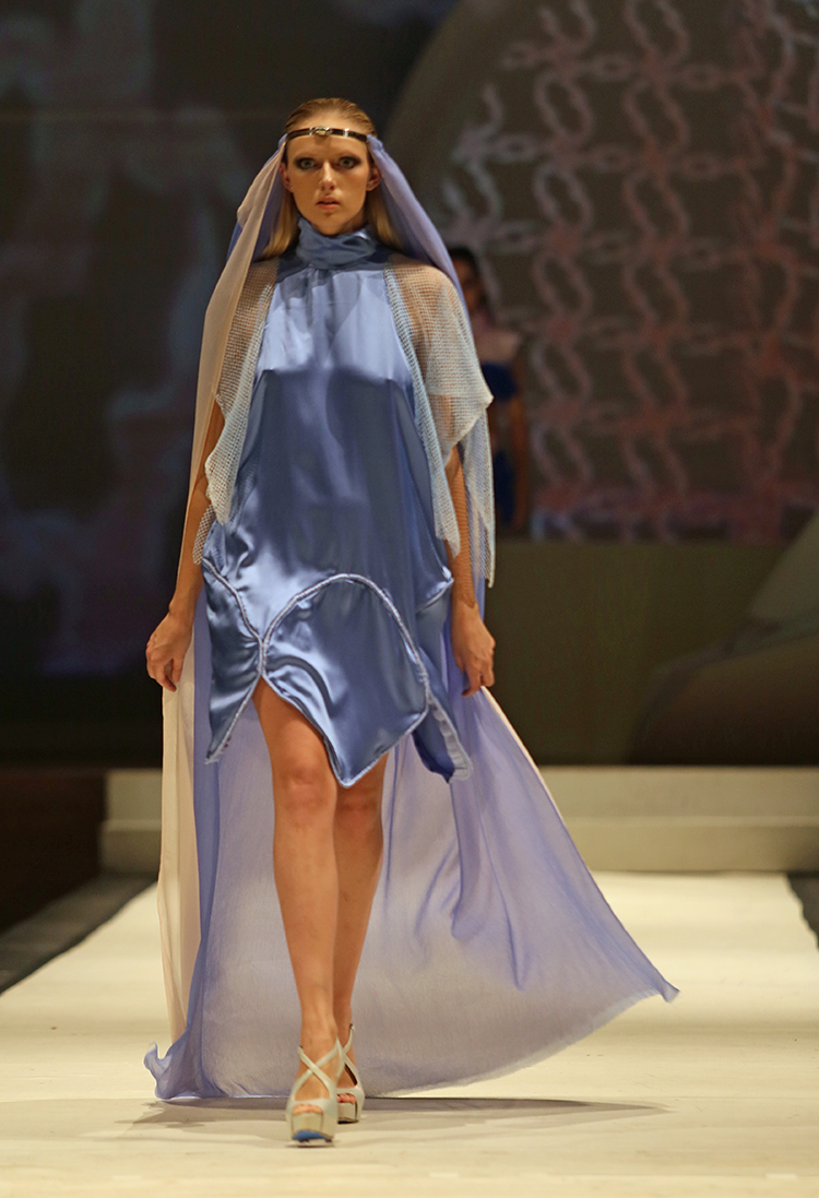 Syracuse University senior Lailee Waxman designed a dress shown at the SU Senior Collection Fashion Show at Goldstein Auditorium. The annual show presents the work of seniors in the College of Visual and Performing Arts fashion design program.  Gloria Wright | Syracuse New Times 