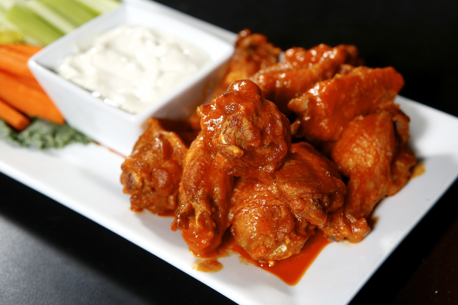 Flat Iron Wings - house special w/ chipolte horseradish served w/ blue cheese, carrots and celery. Michael Davis Photo | Syracuse New Times