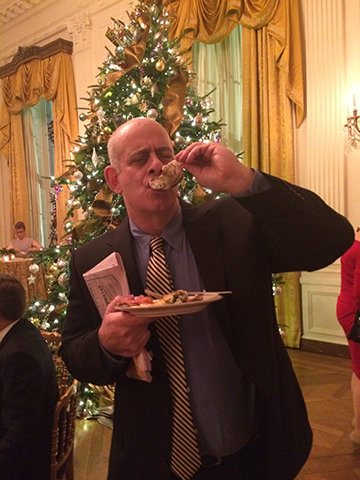 Jeff Kramer slurps an oyster in front of the White House Christmas Tree. 