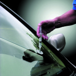 Motorists should perform routine maintenance before beginning a spring or summer road trip, such as fixing windshield nicks.