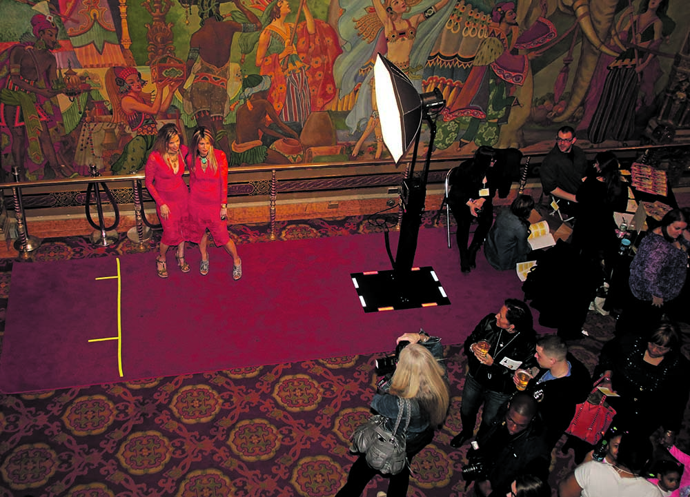 Pausing for photos in the lobby of the Landmark Theater at the Opening Night Gala of Syracuse Fashion Week at the Landmark Theater Wednesday.