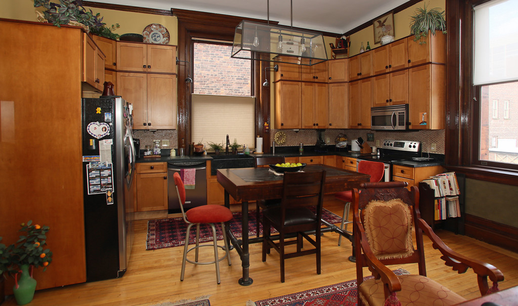 The kitchen at 311 Montgomery St. retains the original woodwork in the 1895 building.