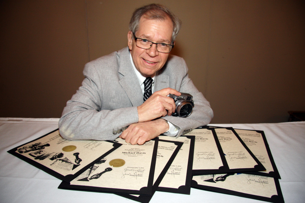 New Times photographer Michael Davis won seven Syracuse Press Club awards, six of them against competition that included all print media in the region. Four of them were for first place in a category.  Photo by Herm Card/Courtesy of Syracuse Press Club