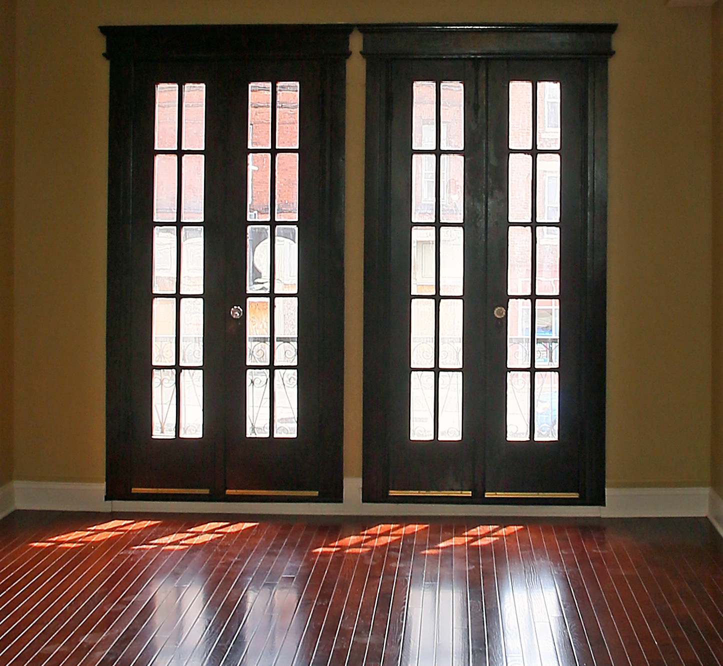 French doors on the second floor bring light into the living room at 537-539 S. Salina St.