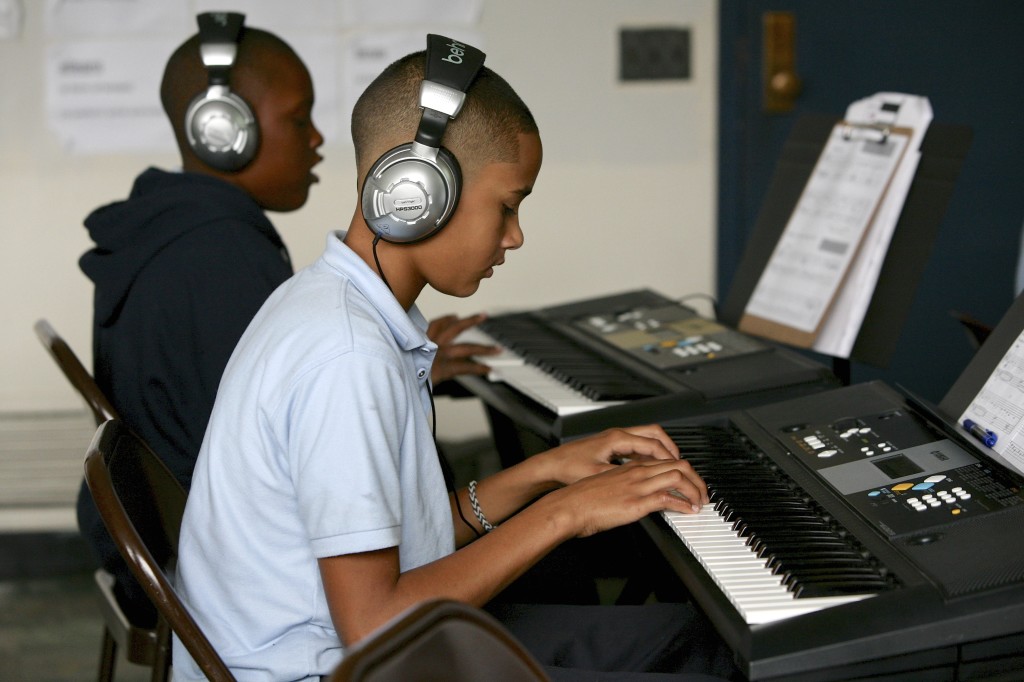 Students using audio equipment. Michael Davis Photo | Syracuse New Times