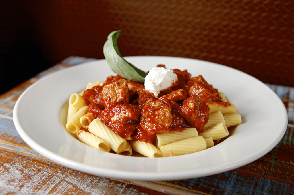 Pascal's Italian Bistro -Sunday Gravy (House Specialty) Rigatoni with Braised Pork & Sausage with San Marzano Plum Tomatoes, Garnished with Fresh Ricotta Cheese. Michael Davis Photo