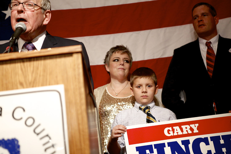 Election 2014 GOP Victory Party - Gary Finch at podium & grandson (center) Michael Davis Photo | Syracuse New Times