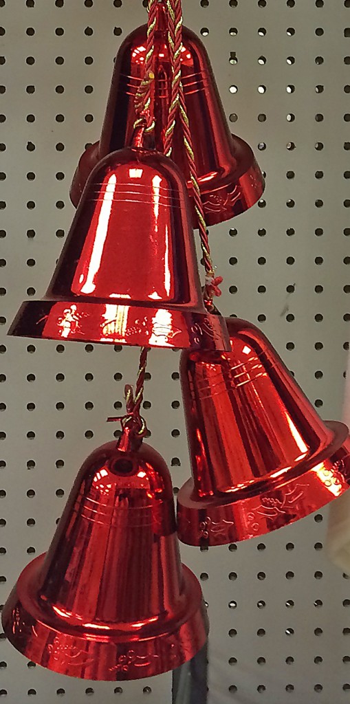 Red bells hanging from a ribbon are available at K-Mart for $12.49.