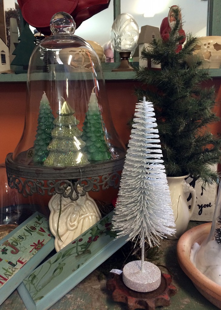 Tree candles under a bell jar, a small tree in a vase and a white bottle tree for $18 are available at Carol Watson Greenhouse,  2980 Sentinel Heights Rd, LaFayette.