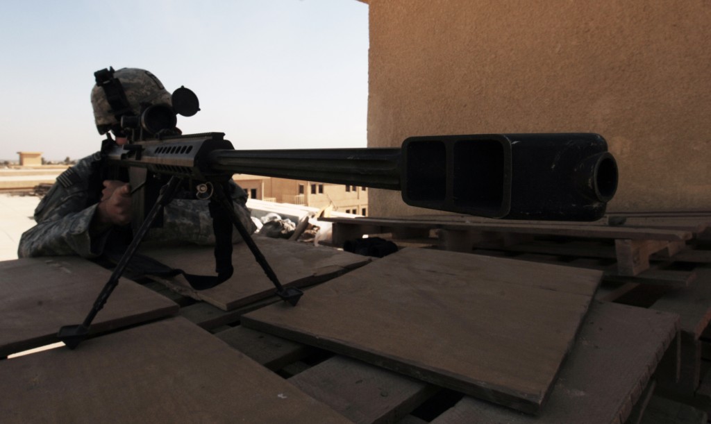 Sgt. Jeremy Rutledge watches the perimeter with his 50 Caliber Sniper rifle, November 29, 2007, Mahmudiyah, Iraq. Sgt. Rutledge is from the 3rd Battalion, 187th Infantry Regiment, 3rd Brigade Combat Team, 101st Airborne Division. U.S. Army photo by Spc. Luke Thornberry