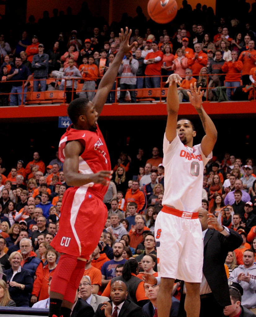 Michael Gbinije shoots over a Cornell player. Michael Davis photo | Syracuse New Times