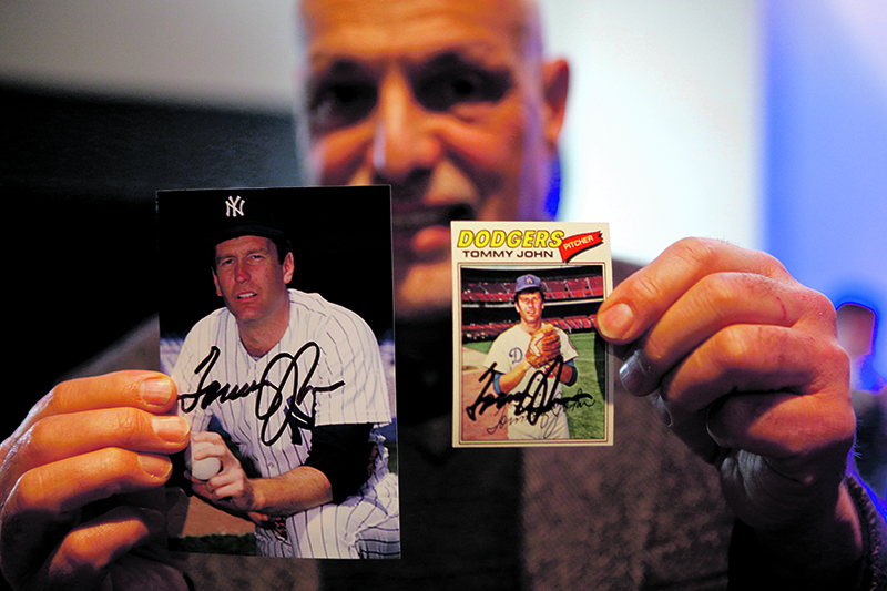 Superfan Marty Nave with Tommy John's autographed baseball cards.  Michael Davis Photo | Syracuse New Times