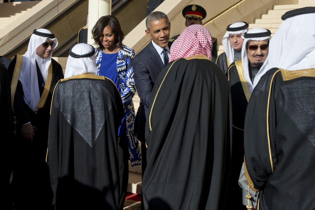 President Barack and first lady Michelle Obama with Saudi King Salman bin Abdul-Aziz Al Saud, right,  after arriving in Riyadh, Saudi Arabia, Jan. 27, 2015. The first lady inspired blaring headlines and endless Internet chatter this week when she was photographed without headgear during the presidential visit to Riyadh, the capital of a conservative Muslim kingdom where women are compelled to cover their hair. (Stephen Crowley/The New York Times)