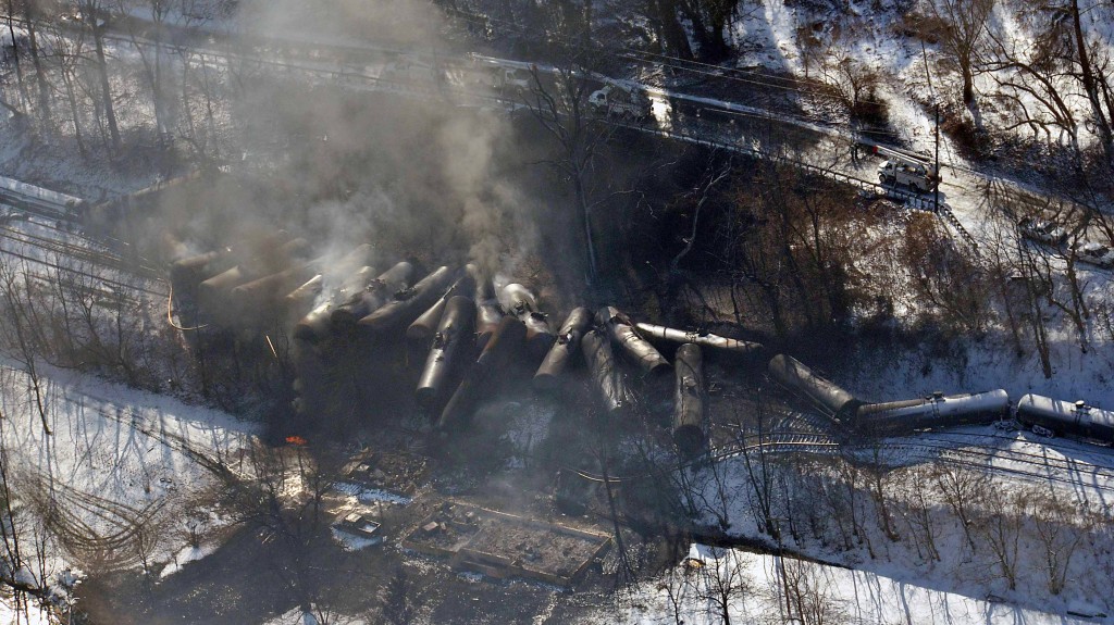 In a handout photo, a train carrying crude oil lies burnt after derailing in Mount Carbon, W.Va., Feb. 17, 2015. An oil train derailment near Galena, Ill. on March 5 - the third such accident in a month - has prompted calls for more aggressive implementation of new safety regulations for the shipment of oil by rail. (Steven Wayne Rotsch/Office of the Governor of West Virginia via The New York Times)