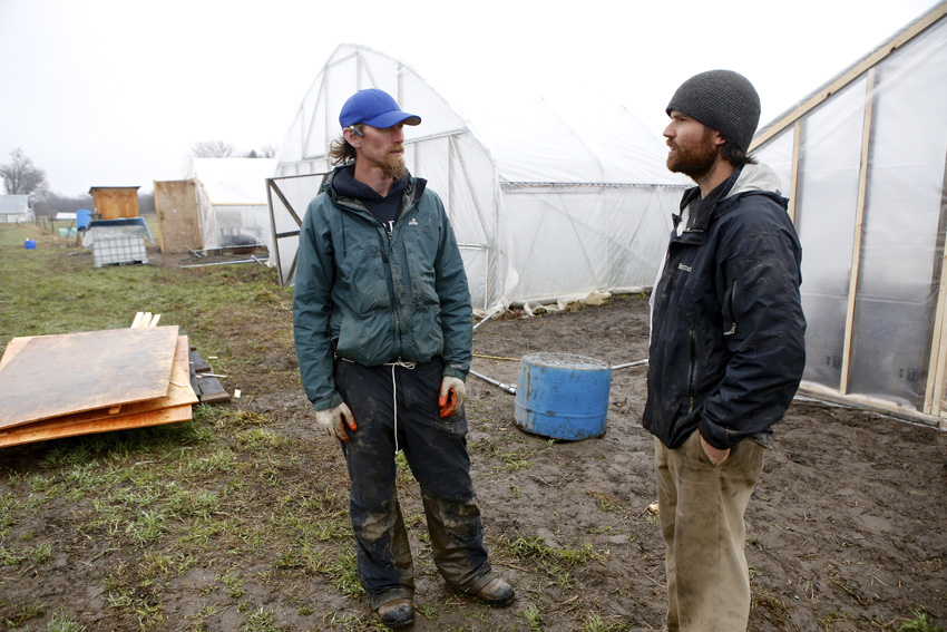 Livestock manager Jon Mahoney with Matt Volz.  Michael Davis Photo | Syracuse New Times