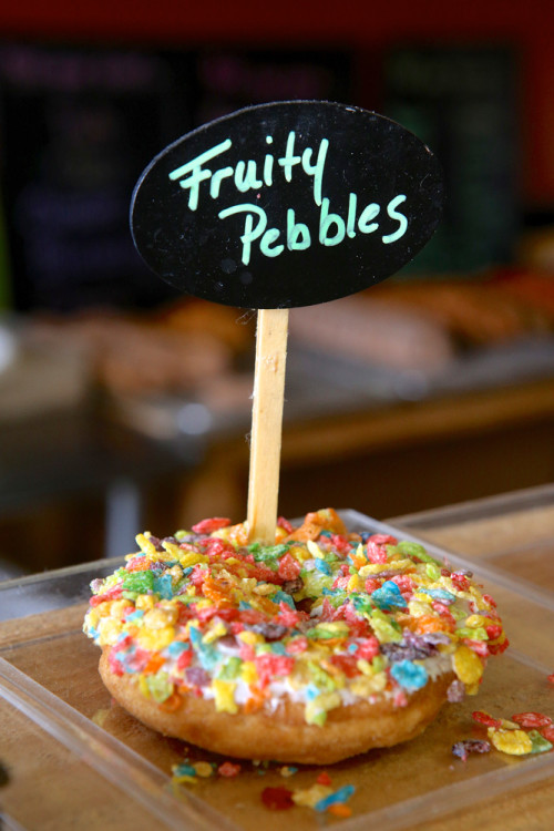A doughnut decorated with the popular children's cereal Fruity Pebbles. Michael Davis photo | Syracuse New Times