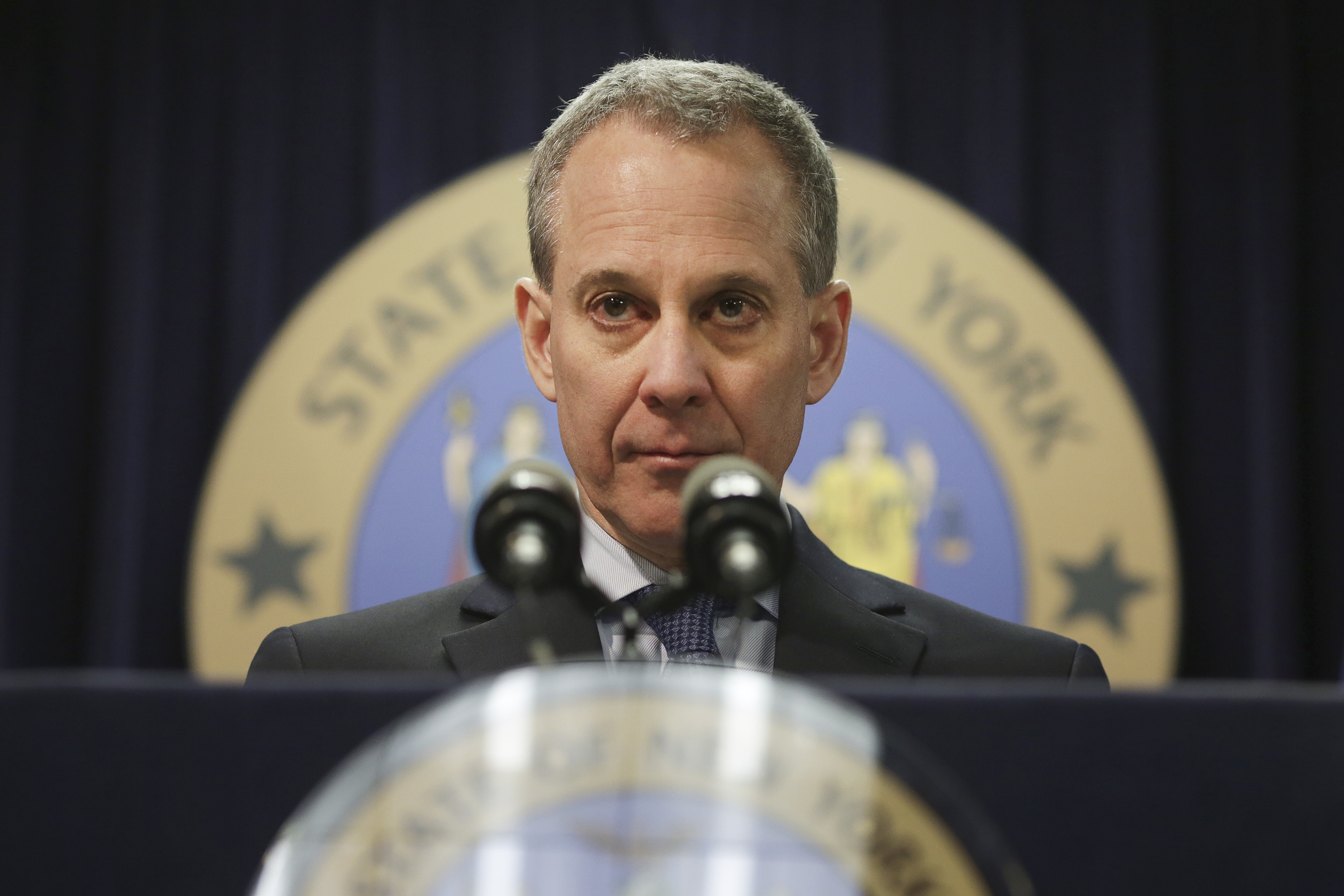 Former NY attorney general Eric Schneiderman stands behind a podium.