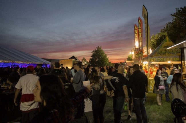 The sun sets in the background, while hundreds are still going strong at Wing Fest 2018