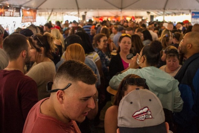 A wide shot of a congested crowd of hundreds at Wing Fest 2018