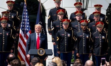 President Donald Trump during the singing of God Bless America during a "Celebration of America" event in the Rose Garden of the White House, June 5, 2018. The Philadelphia Eagles had been scheduled to attend a celebration of their Super Bowl victory at the White House on Tuesday afternoon. But in a statement on Monday night, Trump abruptly disinvited the team, accusing it of trying to make a political statement about the anthem. (Doug Mills/The New York Times) -