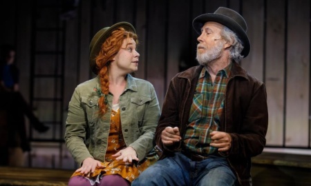 A scene from Anne of Green Gables shows red-headed Anne eagerly talking to an old man.