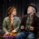 A scene from Anne of Green Gables shows red-headed Anne eagerly talking to an old man.