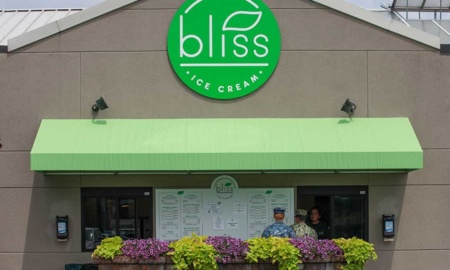 Bliss Ice Cream features a bright green, circle logo over a matching green outdoor canopy.