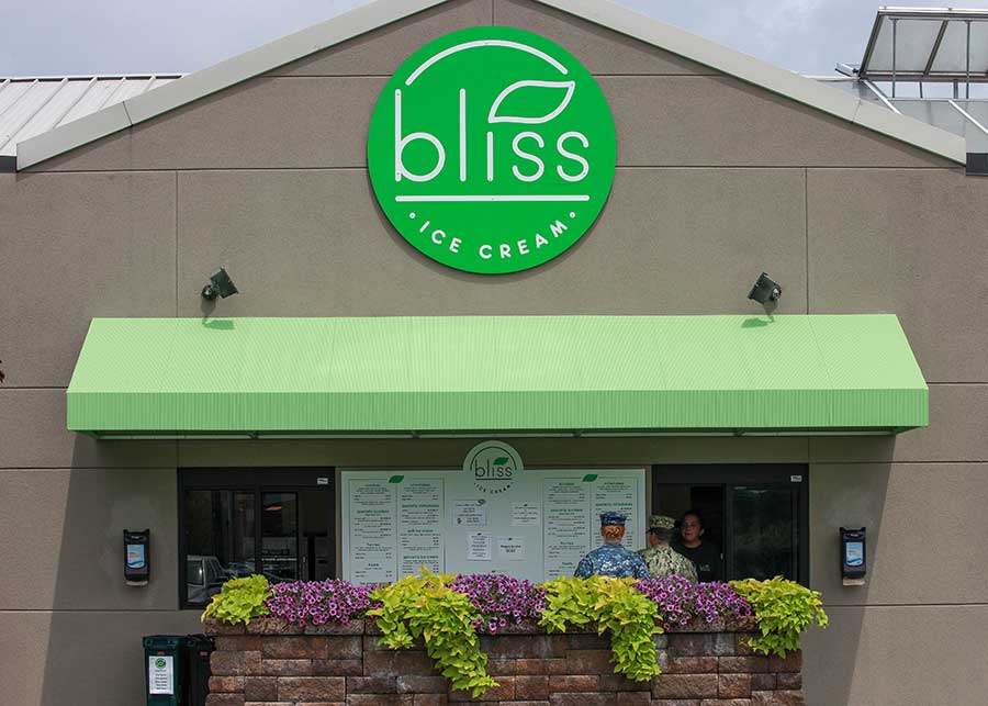 Bliss Ice Cream features a bright green, circle logo over a matching green outdoor canopy.