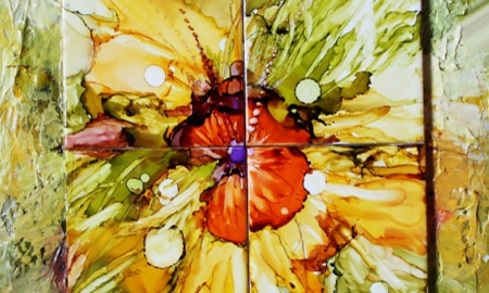 A piece of art in the Edgewood show shows four tiles in a square, with splashed of red, yellow and other warm colors across the center in an abstract patter
