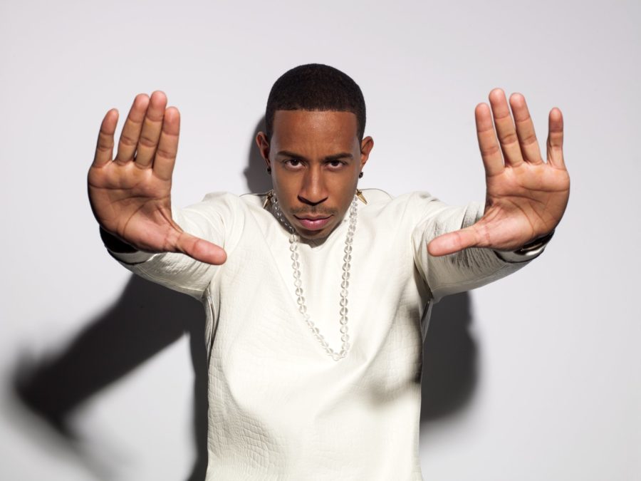 Rapper Ludacris poses with his hands out ni front of him. He'll be giving a free show at Chevy Court.